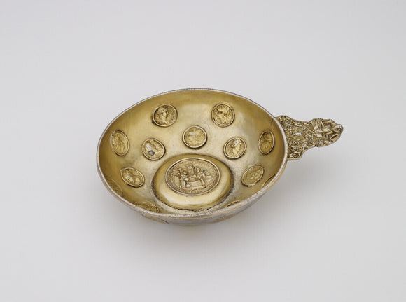 Bowl set with casts of Roman coins and a medallion of Christ and the Woman of Samaria at the well