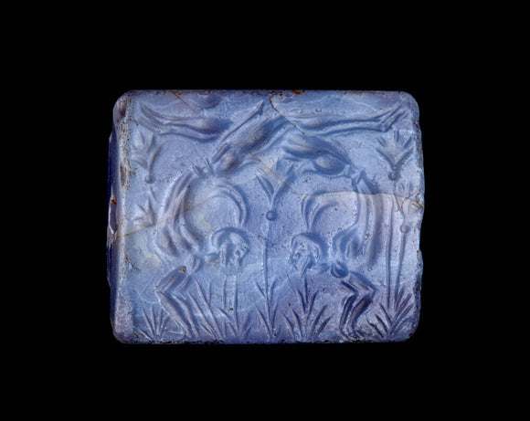 Seal depicting tumblers or acrobats in a field of lilies