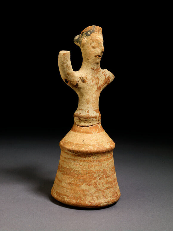Terracotta figurine of female in bell skirt with raised arms