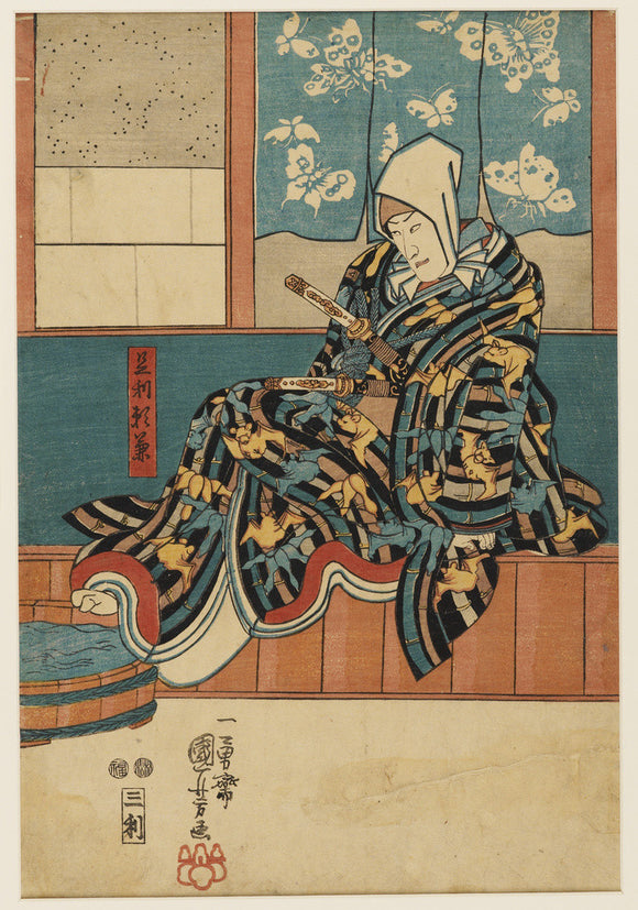 Man seated by a bath