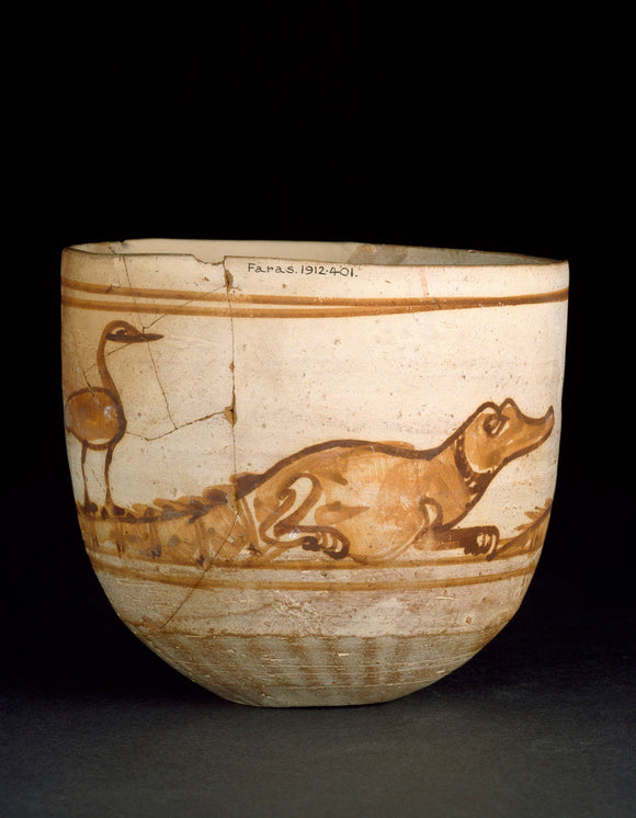 Cup decorated in red with a scene of two crocodiles with birds on their tails
